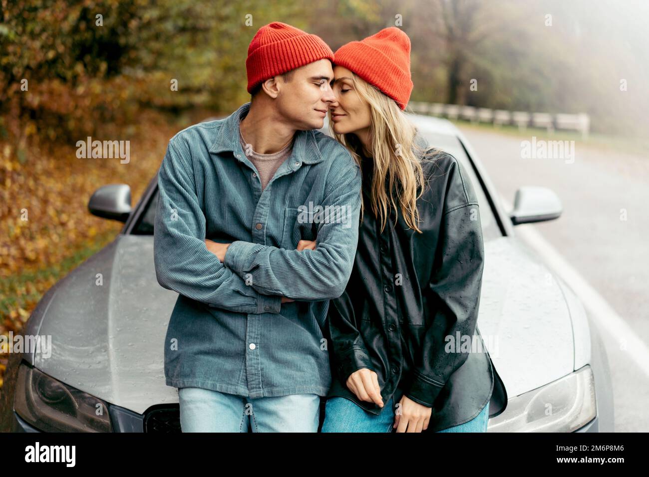 Young Couple Sitting On Bonnet Parked Stock Photo 215278807