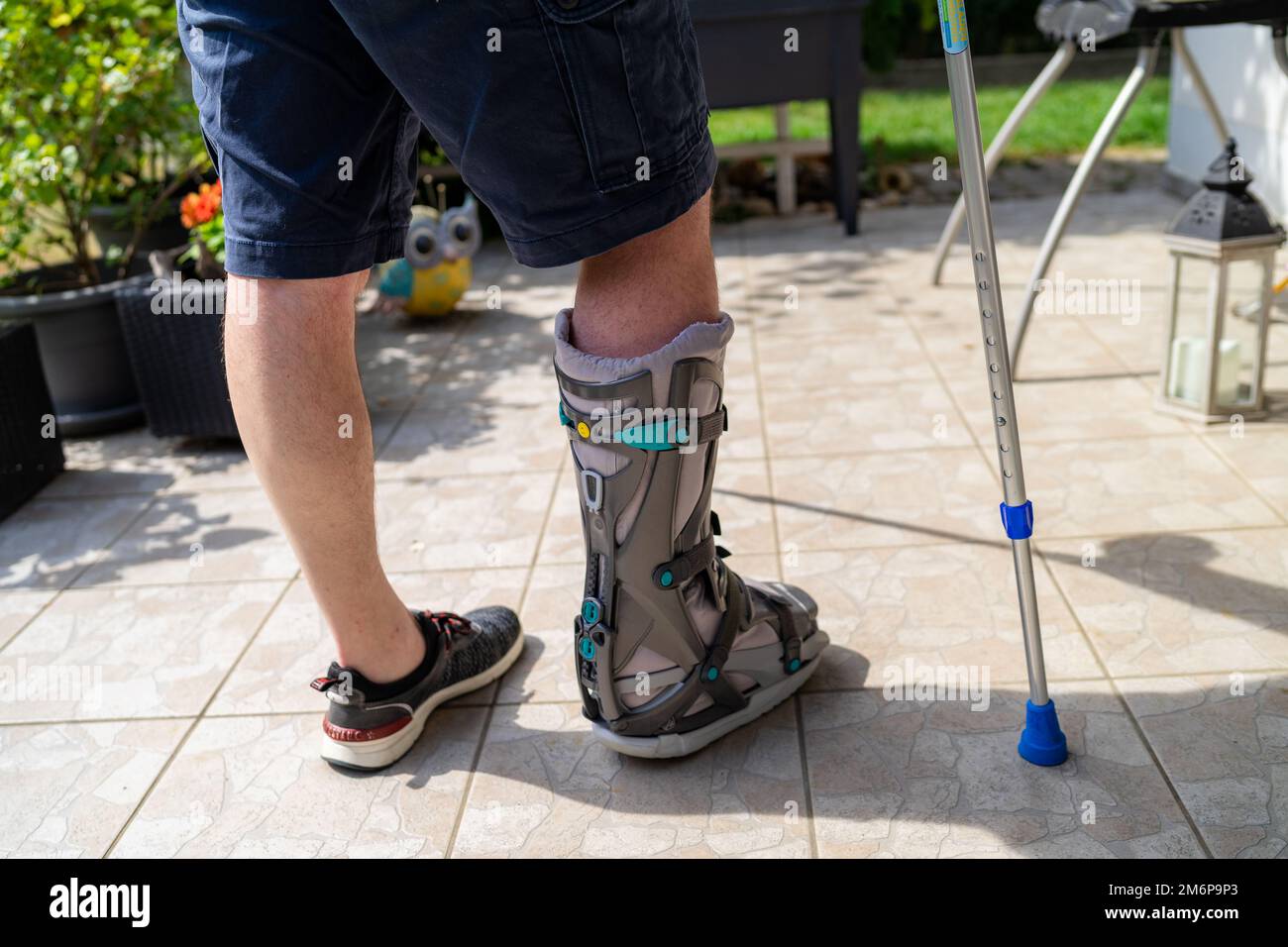 Broken Leg with Orthese and Crutches after Accident in Bavaria Germany. Stock Photo