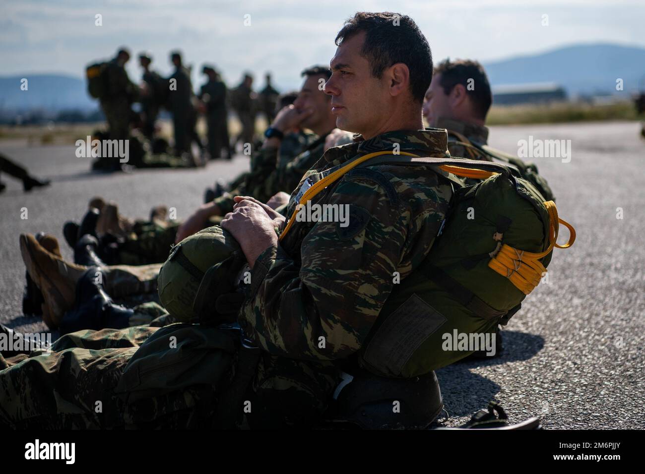 A Greek paratrooper prepares to participate in an airdrop during Exercise Stolen Cerberus IX at Elefsina Air Base, Greece, May 3, 2022. The objective of the training deployment and exercise is to enhance interoperability and airlift capabilities between U.S. and Greek Armed Forces, strengthen bilateral defense ties and execute aeromedical evacuation and jump training. Stock Photo