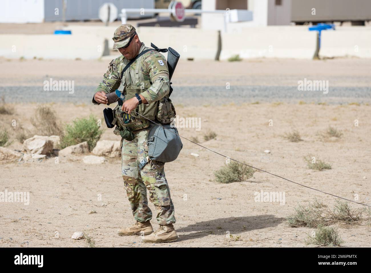 CAMP BUEHRING, Kuwait - U.S. Army Staff Sgt. Heriberto Sosa, assigned to the 1st Battalion, 124th Infantry Regiment, arranges a M-18 Claymore mine during the 2022 Best Squad Competition at Camp Buehring, Kuwait May 4, 2022. BSC 2022 measures the abilities of squads to perform physical and mental challenges as a cohesive team. Stock Photo