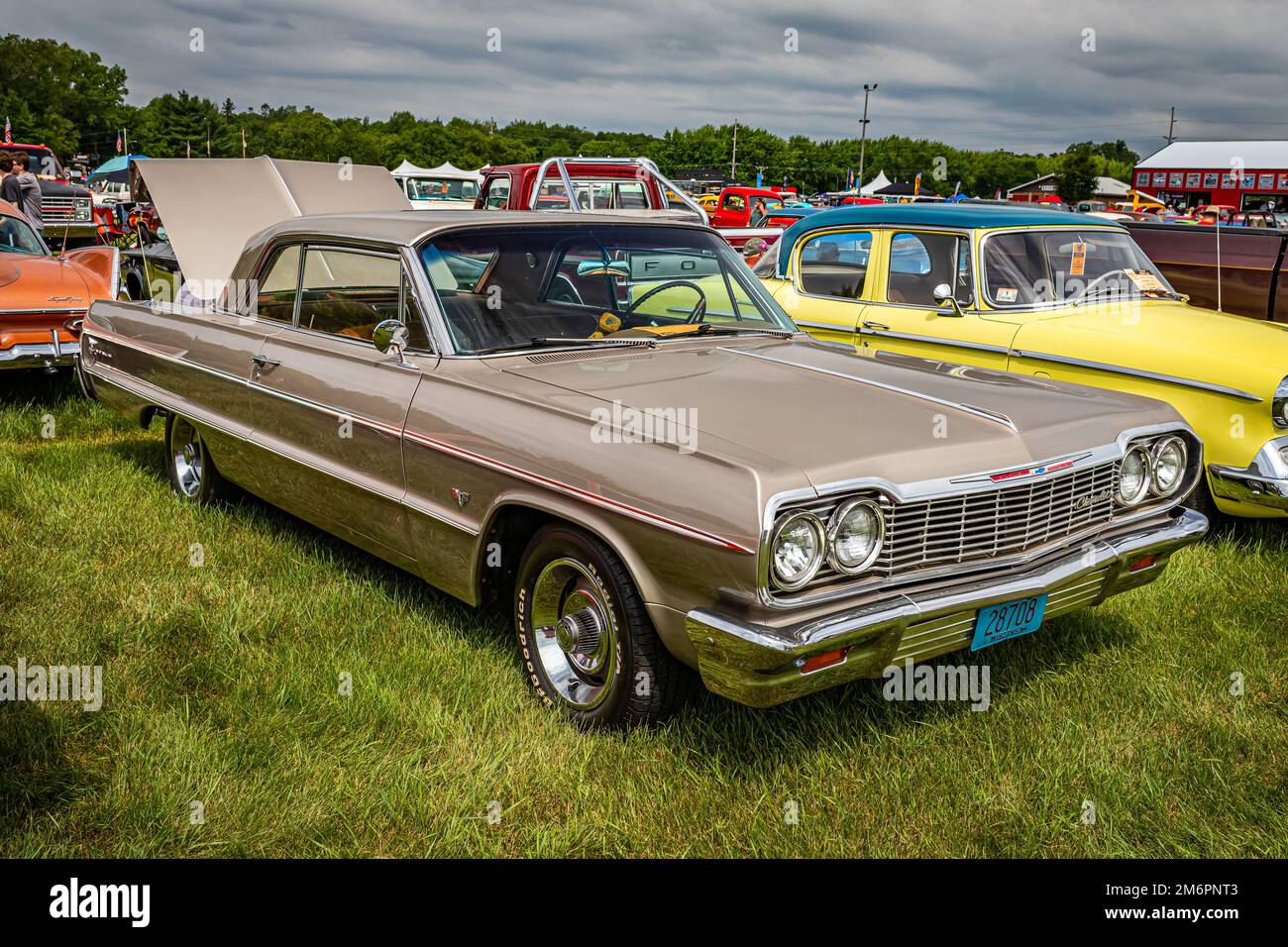 Iola, WI - July 07, 2022: High perspective front corner view of a 1964 Chevrolet Impala 2 Door Hardtop at a local car show. Stock Photo