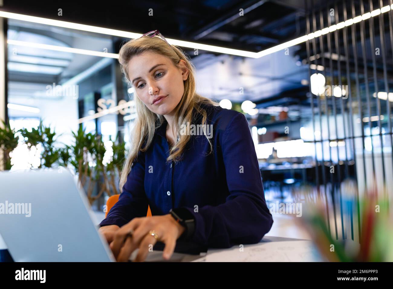 Caucasian woman working on her laptop Stock Photo - Alamy