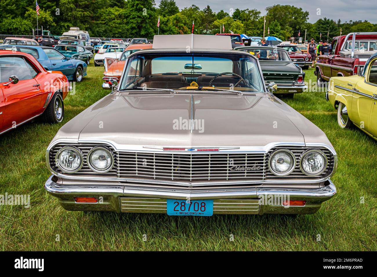 Iola, WI - July 07, 2022: High perspective front view of a 1964 Chevrolet Impala 2 Door Hardtop at a local car show. Stock Photo