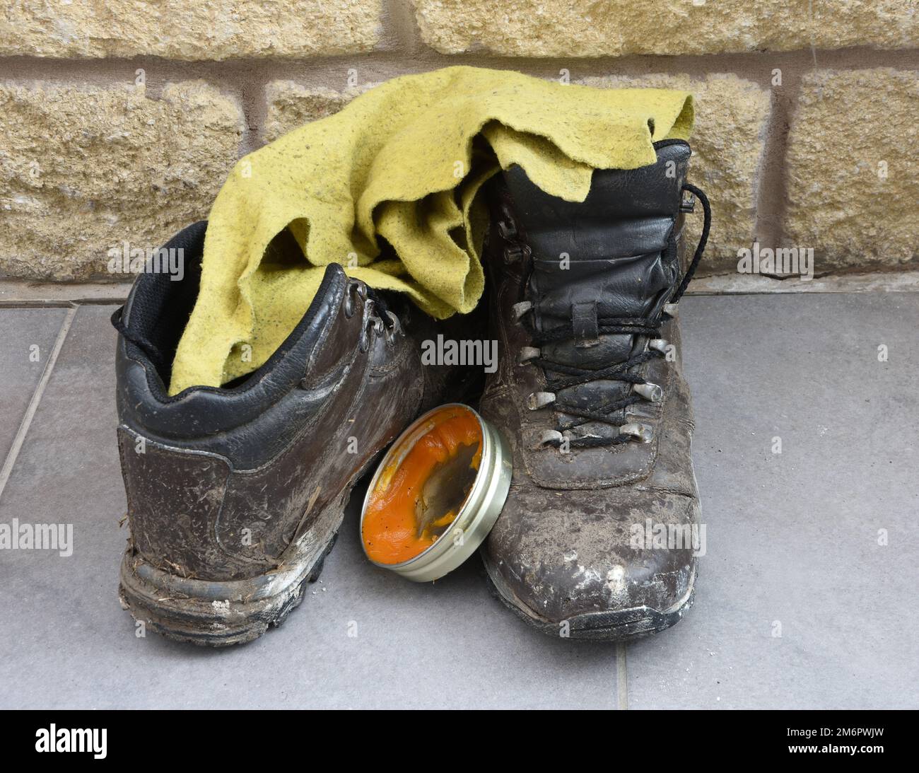 Walking boots after a hard days walking waiting to be cleaned with a