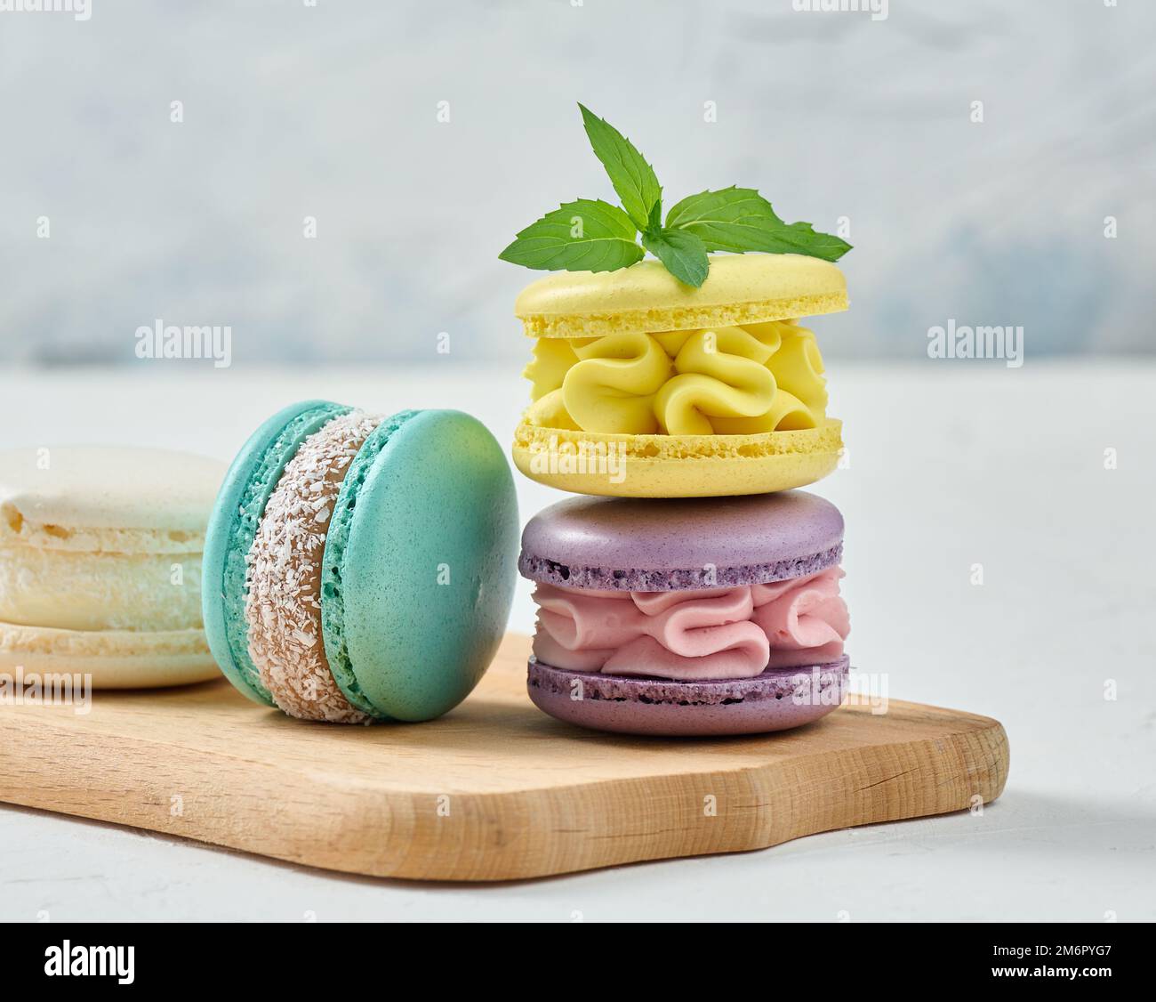 Stack of colorful macaroons on white background Stock Photo