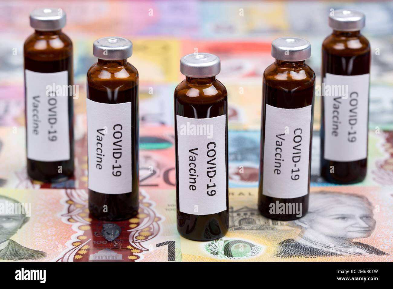 Vaccine against Covid-19 on the background of Australian money Stock Photo