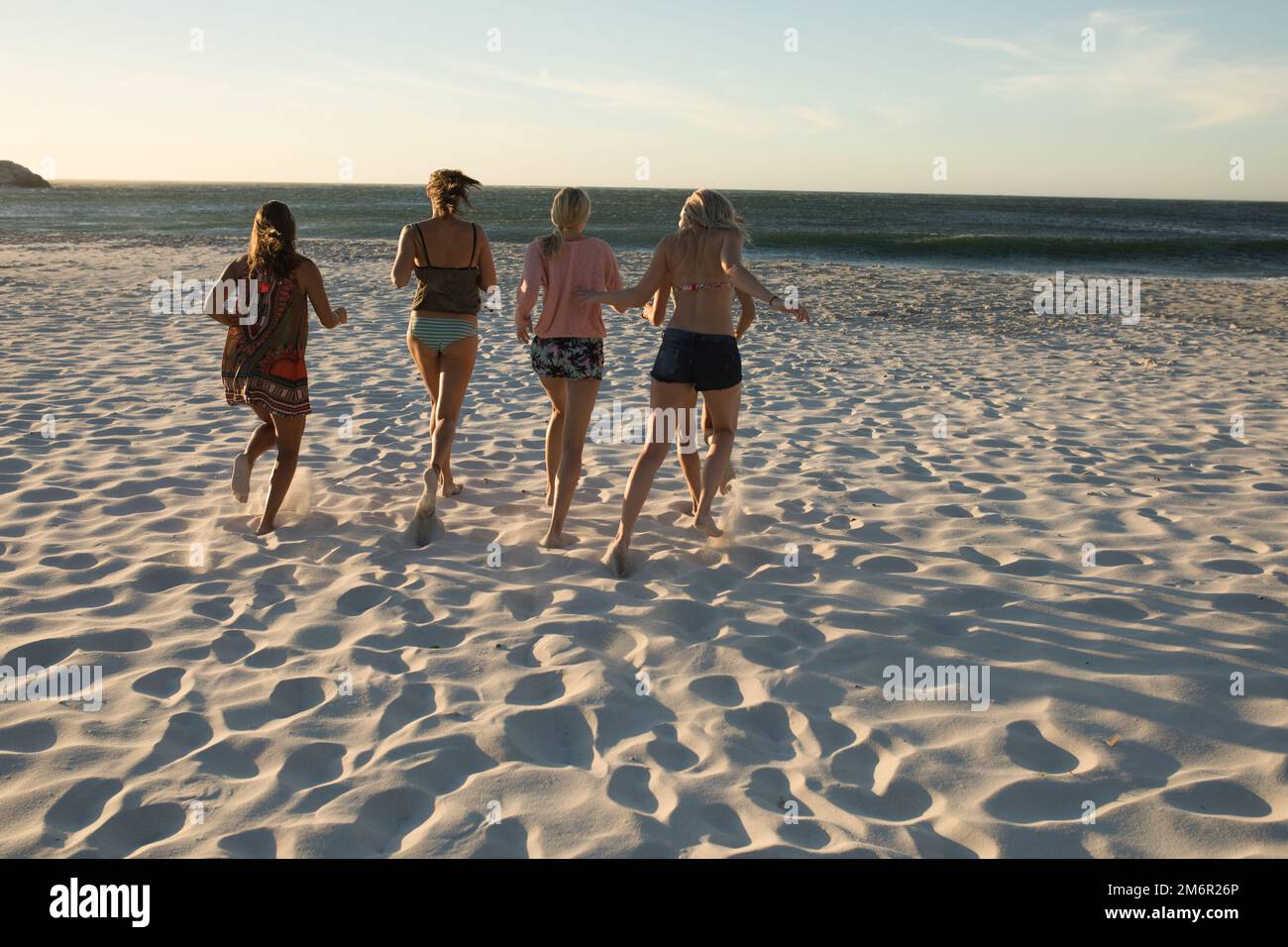 Young women on hot beach hi-res stock photography and images - Alamy