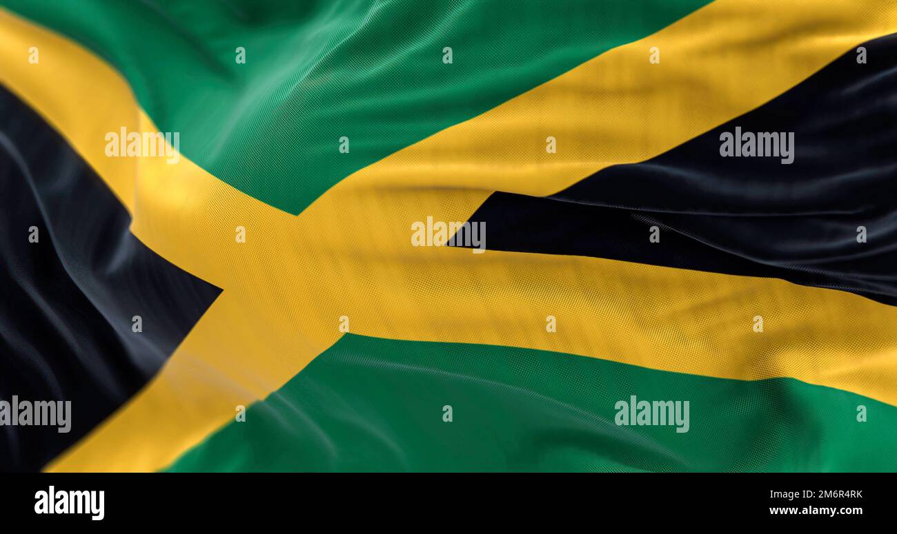 Close-up view of the Jamaica national flag waving. Jamaica is an island country situated in the Caribbean Sea. Rippled Fabric. Textured background. Se Stock Photo