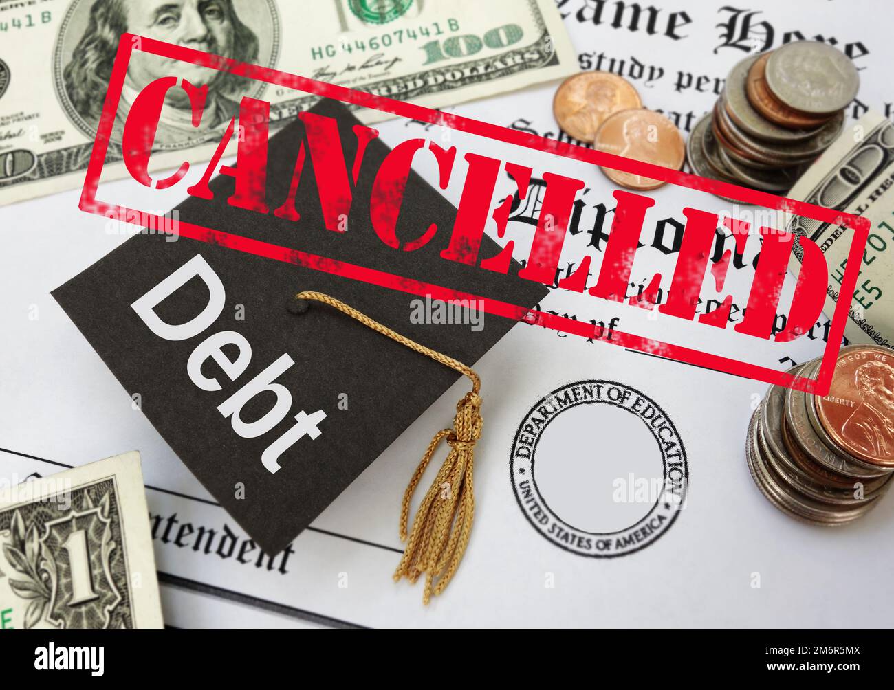 Cancelled stamp over student loan debt graduation cap and money Stock Photo