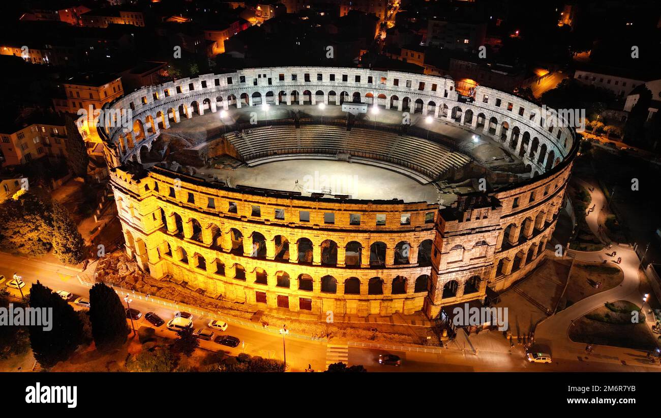 An aerial shot of the Pula Arena illuminated at night in Pula, Croatia Stock Photo