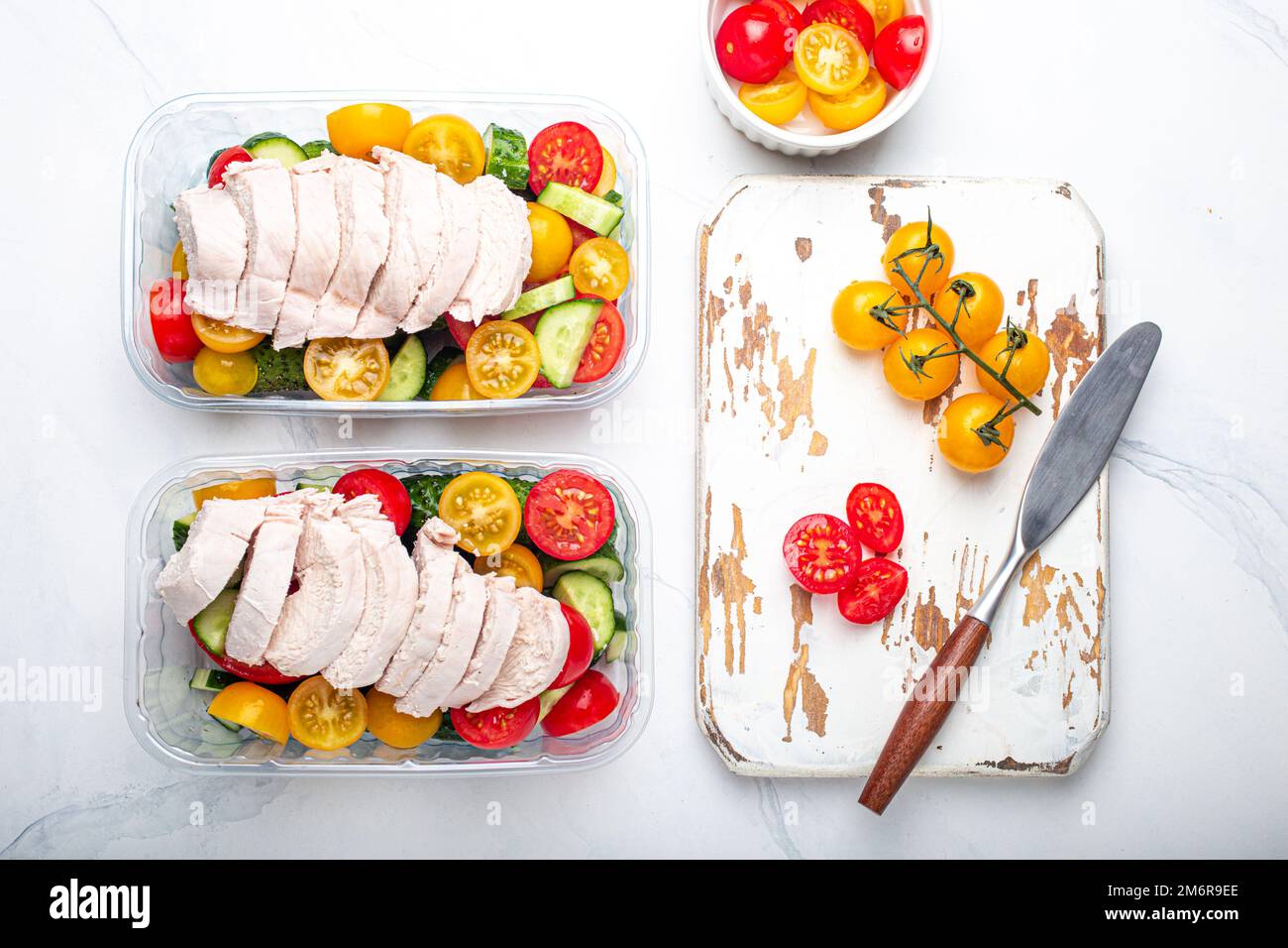Meal prep lunch boxes containers with chicken and salad top view Stock Photo