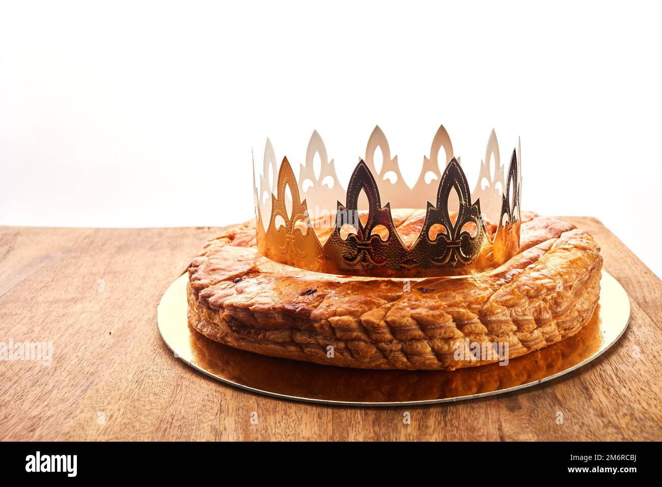 King cake or galette des rois in French. Epiphany pie with golden paper