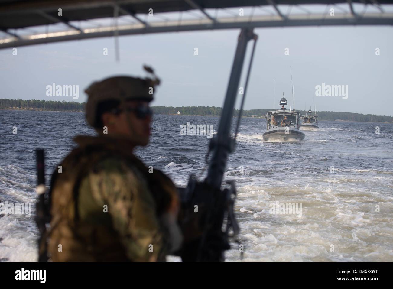 US Navy Engineman 2nd Class Anthony Bartelli (right) holds an