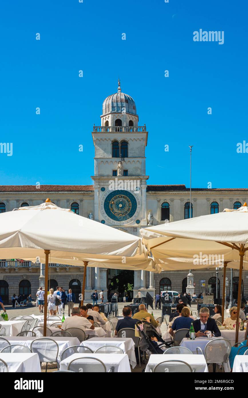 Padua piazza, view in summer of people sitting at cafe tables in the scenic Piazza dei Signori in Padua (Padova), Veneto, Italy Stock Photo