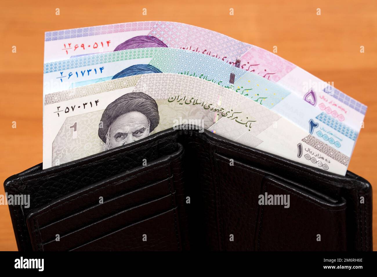 Iranian money in the black wallet Stock Photo Alamy