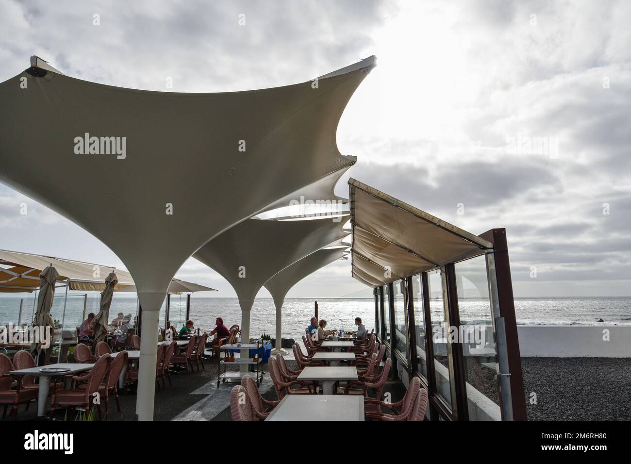 Seaside restaurant terrace with modern backlit umbrellas Stock Photo ...