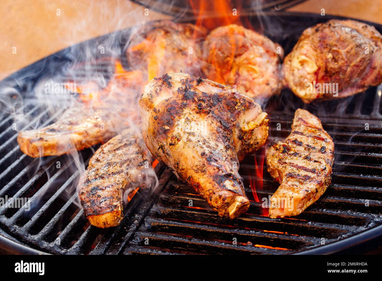 Traditional barbecue lamb shanks and saddle grilled as closeup on a