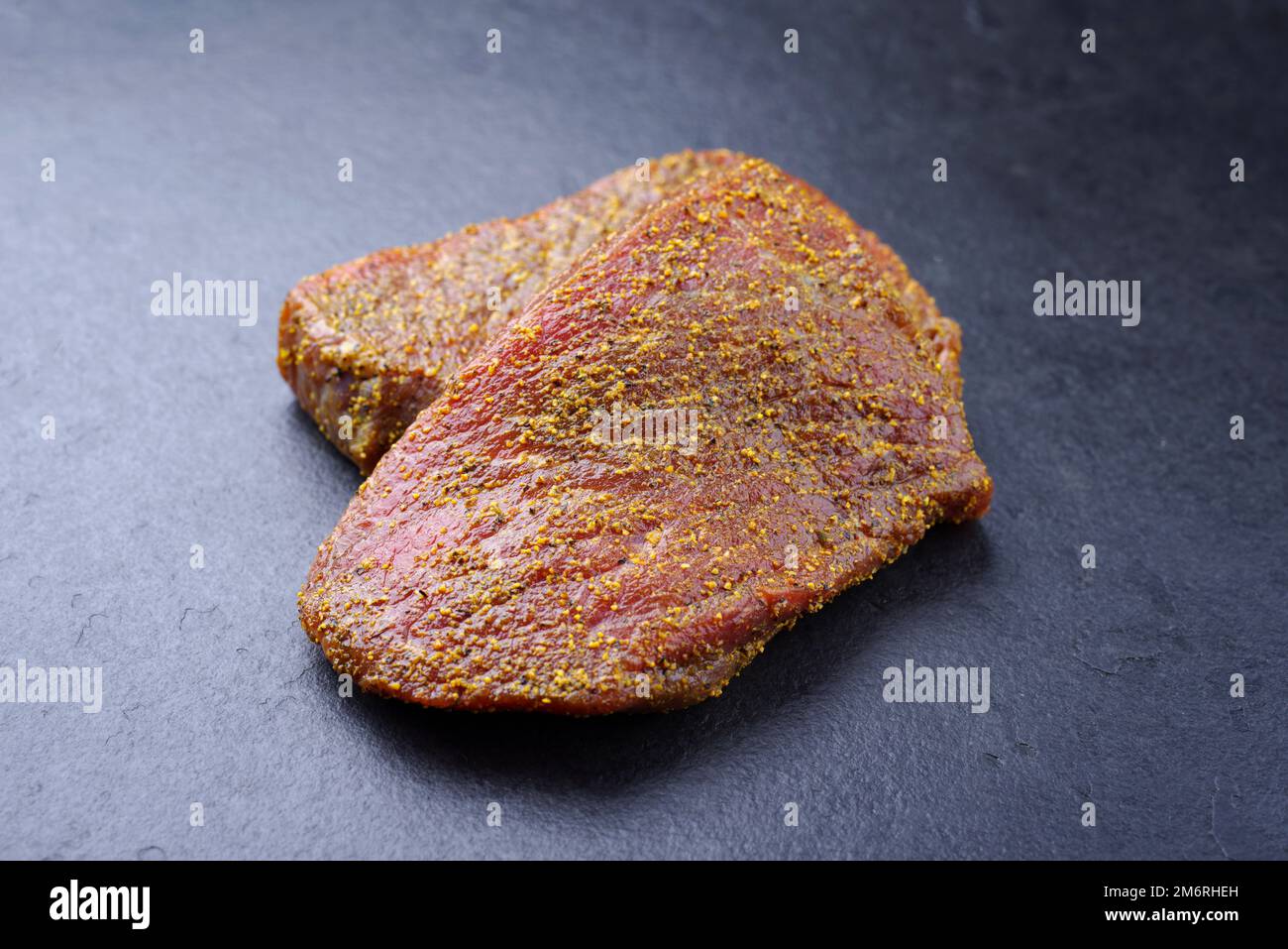 Peppered Rump Raw marinated pepper rump steak of beef prepared for a summer barbecue ...
