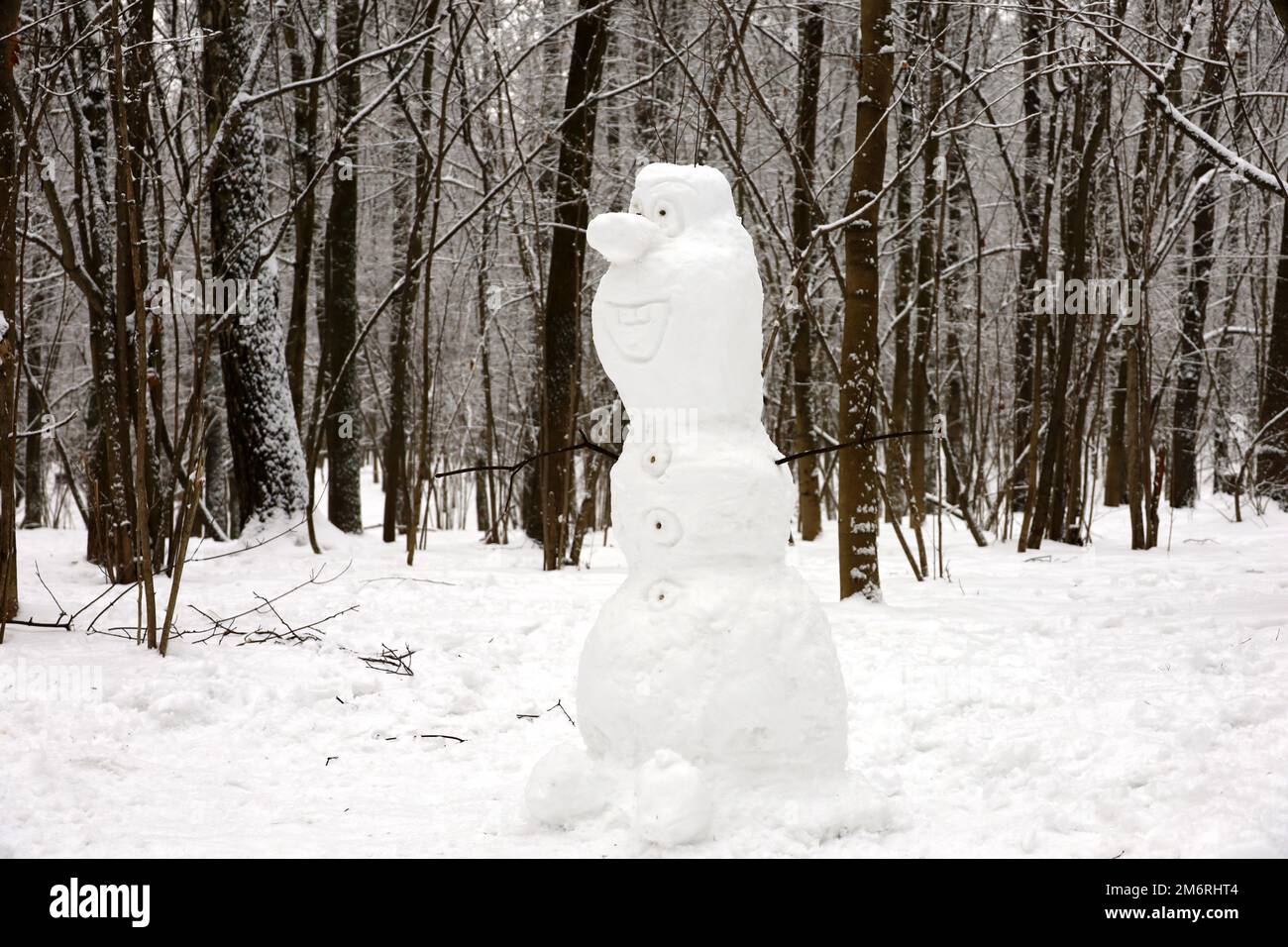 Snowman in a winter park. Children's creativity, leisure at cold weather Stock Photo