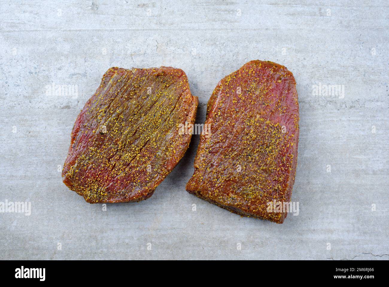 Peppered Rump Raw marinated pepper rump steak of beef prepared for a summer barbecue ...
