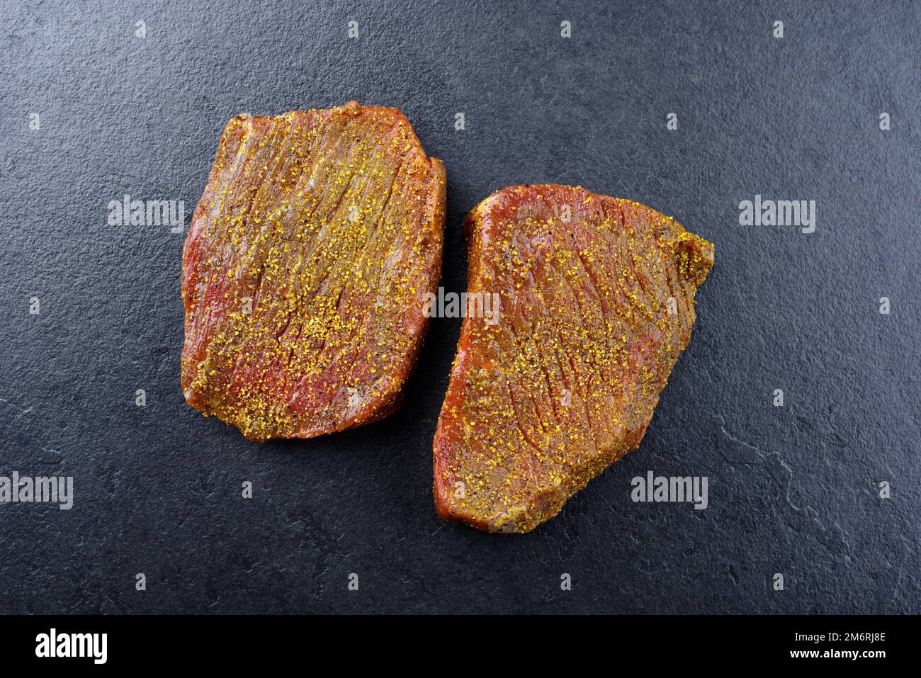 Peppered Rump Raw marinated pepper rump steak of beef prepared for a summer barbecue ...