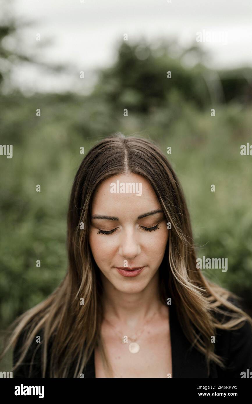 Young woman with closed eyes in portrait, 25 Stock Photo