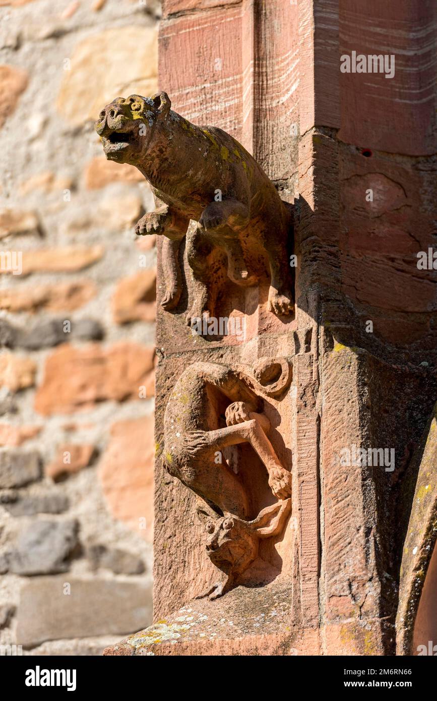 Medieval mythical creatures, gargoyles on the portal of the porch