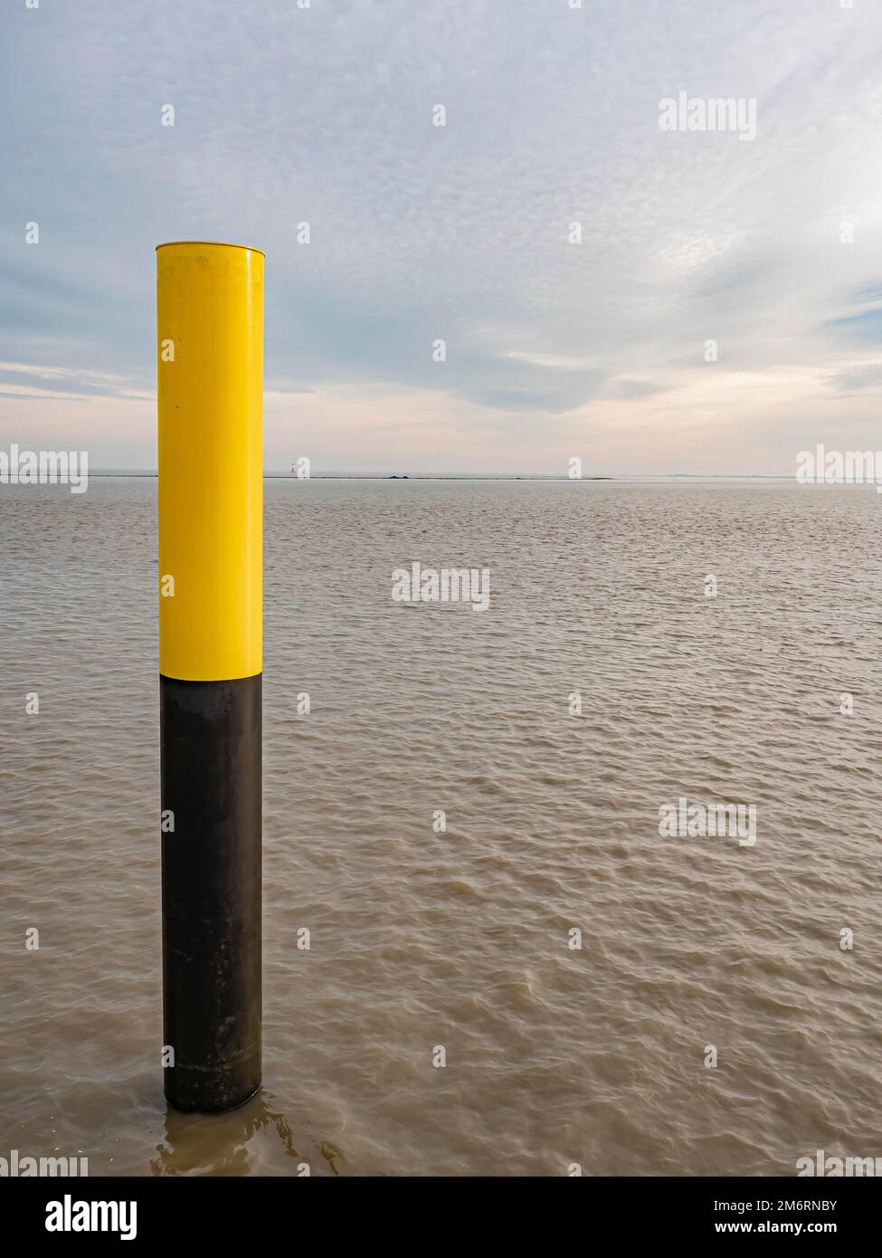 Post yellow black, view over the Jadebusen from the harbour of Wilhelmshaven, Wilhelmshaven, Lower Saxony, Germany Stock Photo