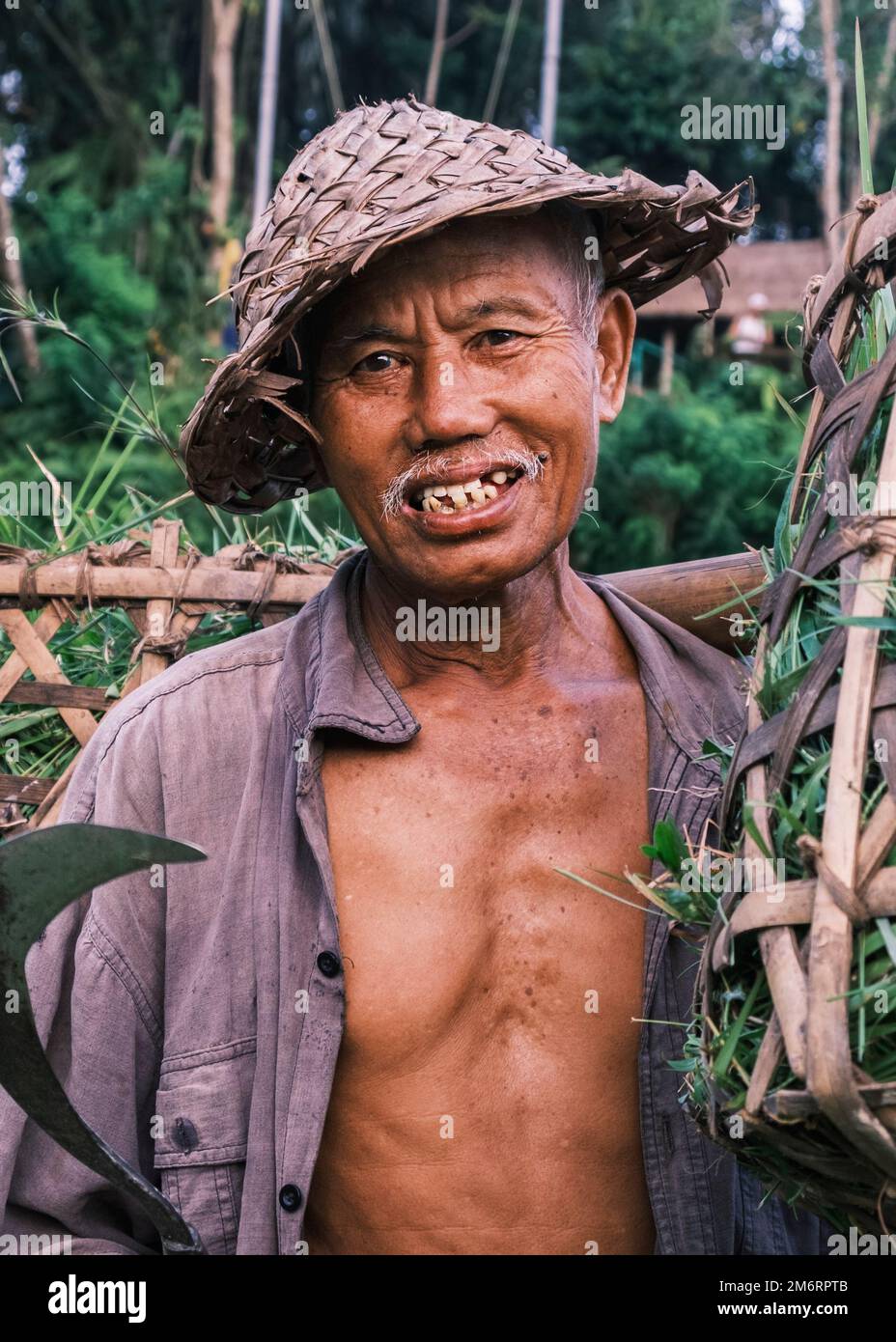 Vertical Portrait Of A South Asian Balinese Senior Men Wearing A