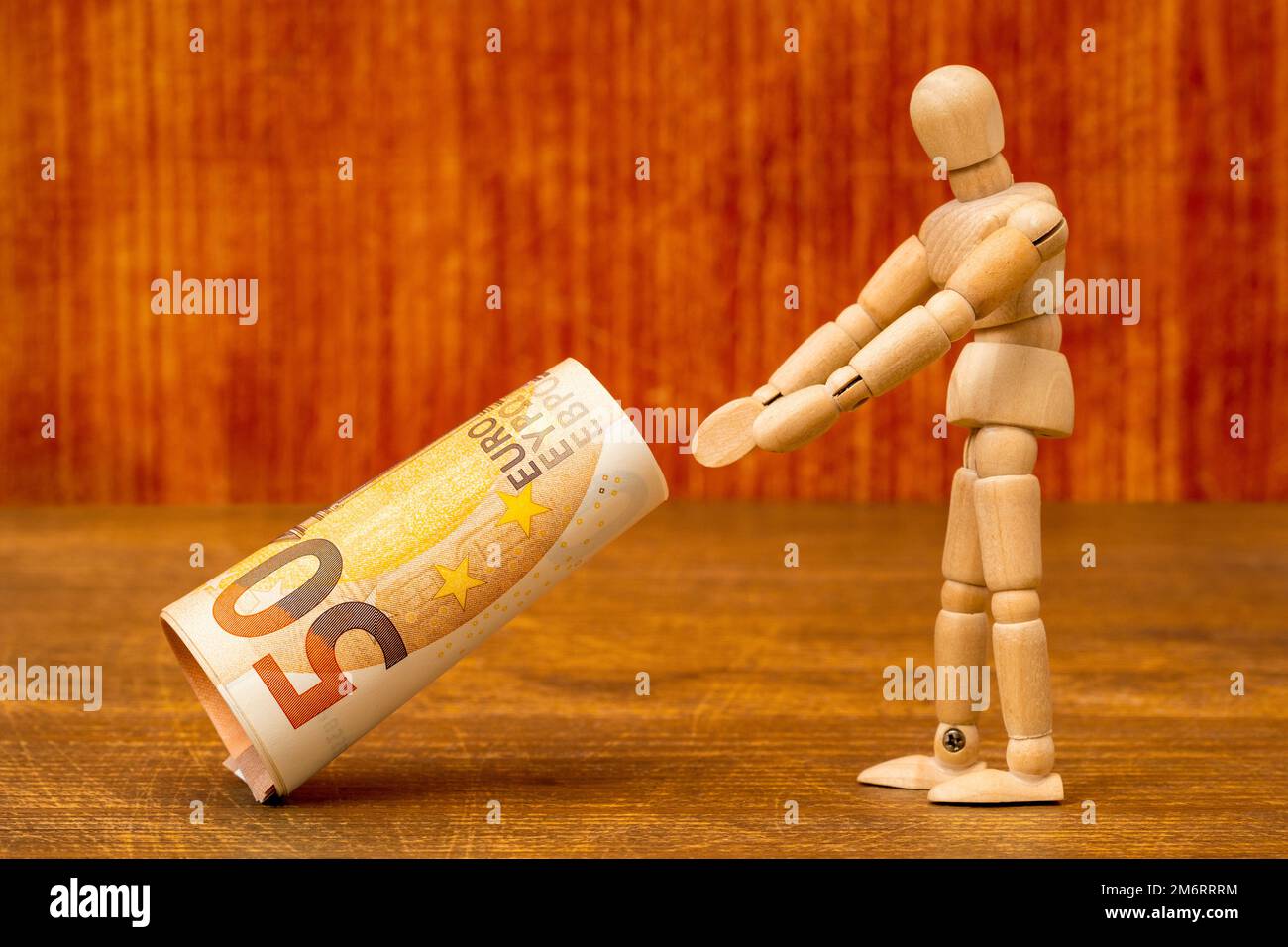 Dummy catching or dropping roll of fifty euros Stock Photo