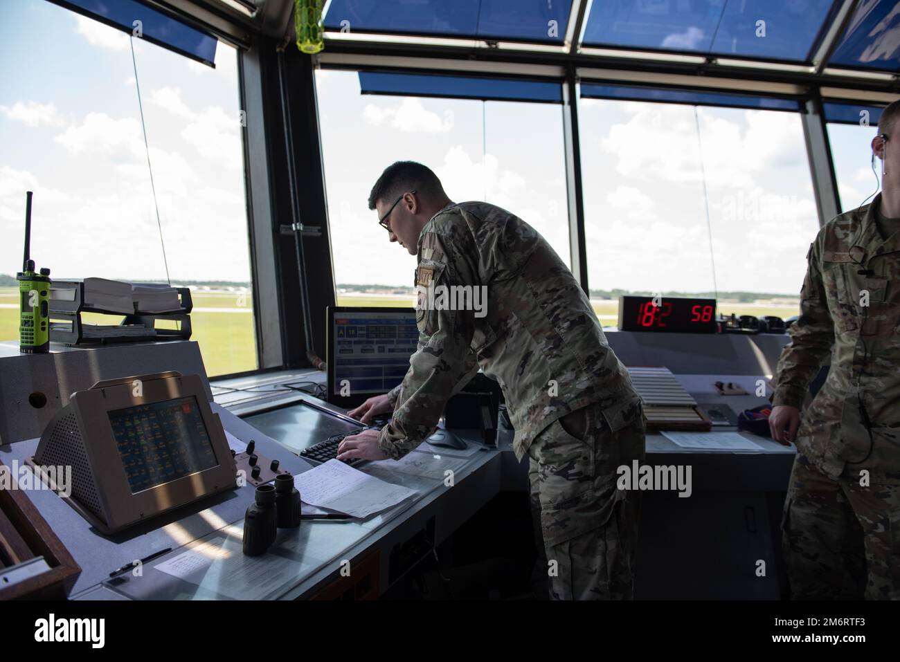 U.S. Air Force Senior Airman Justin Bullitt, 23rd Operational Support Squadron air traffic control trainer, checks monitors while on duty at Moody Air Force Base, Georgia, May 4, 2022. Air traffic control Airmen use various methods to aid in tracking reports and flight paths. Stock Photo