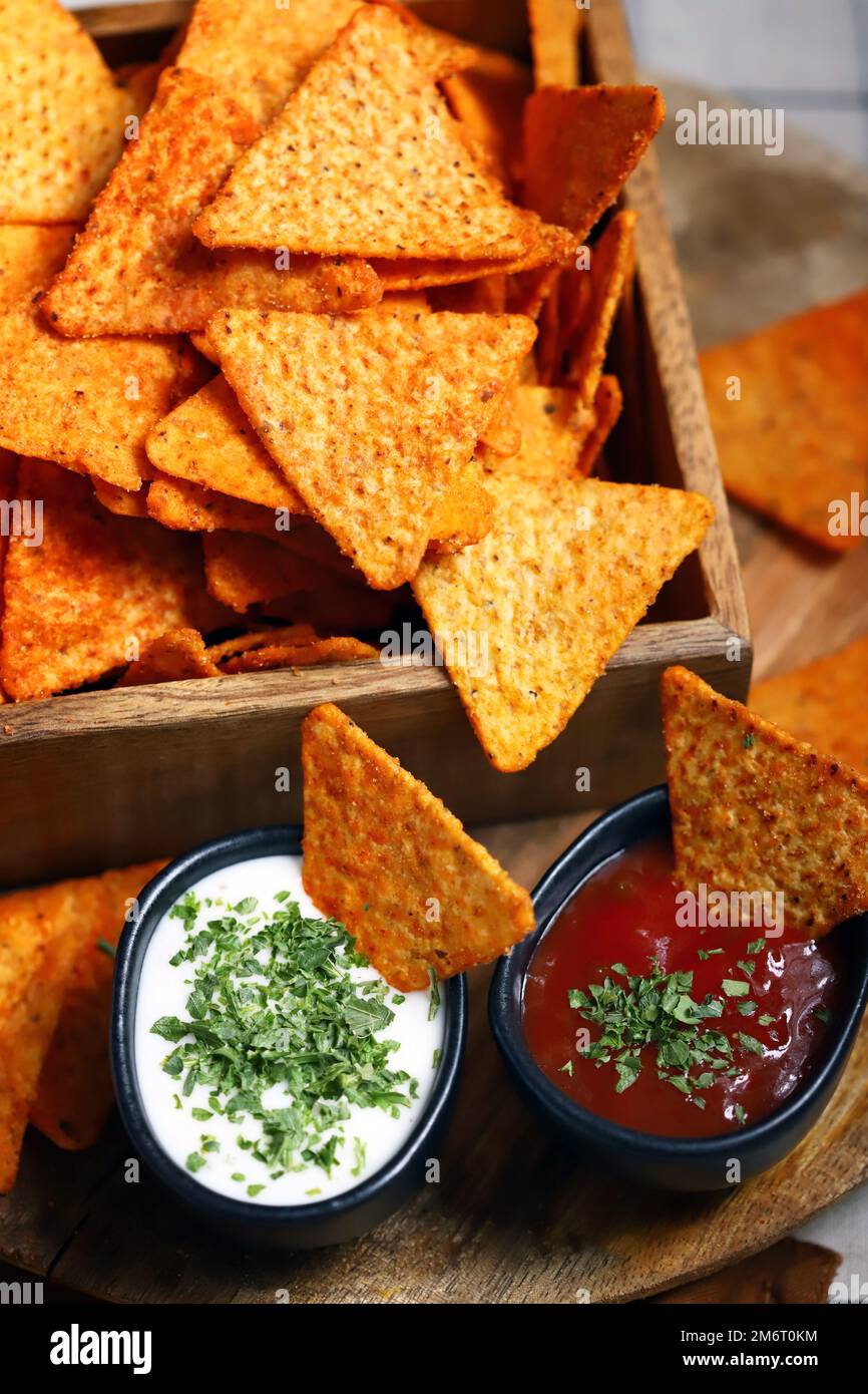 Chips nachos with sauces. Mexican snacks. Stock Photo