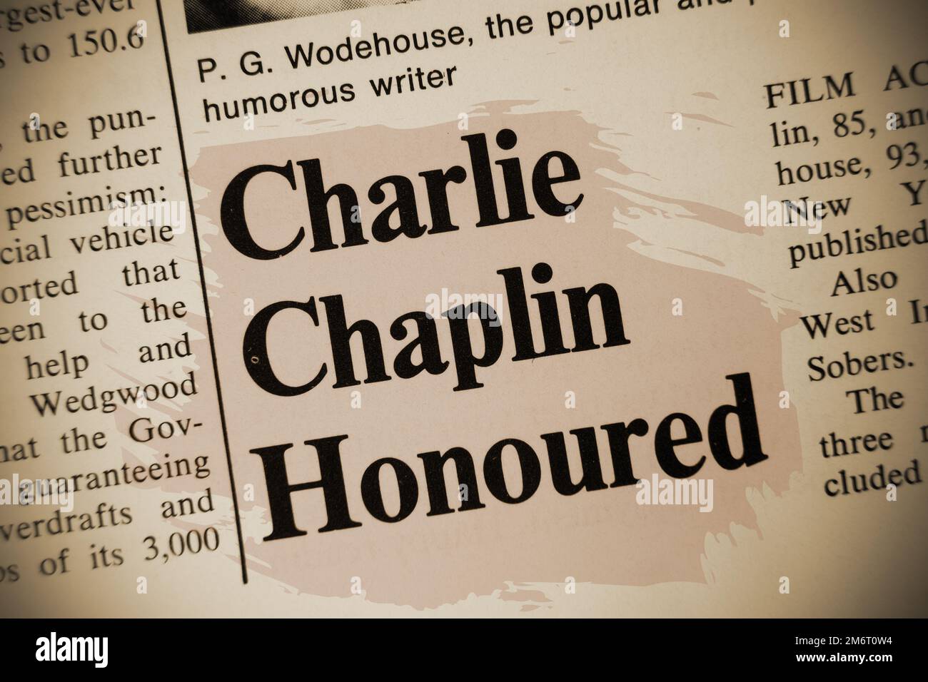 news story from 1975 newspaper headline article title - Charlie Chaplin Honoured - sepia overlay Stock Photo