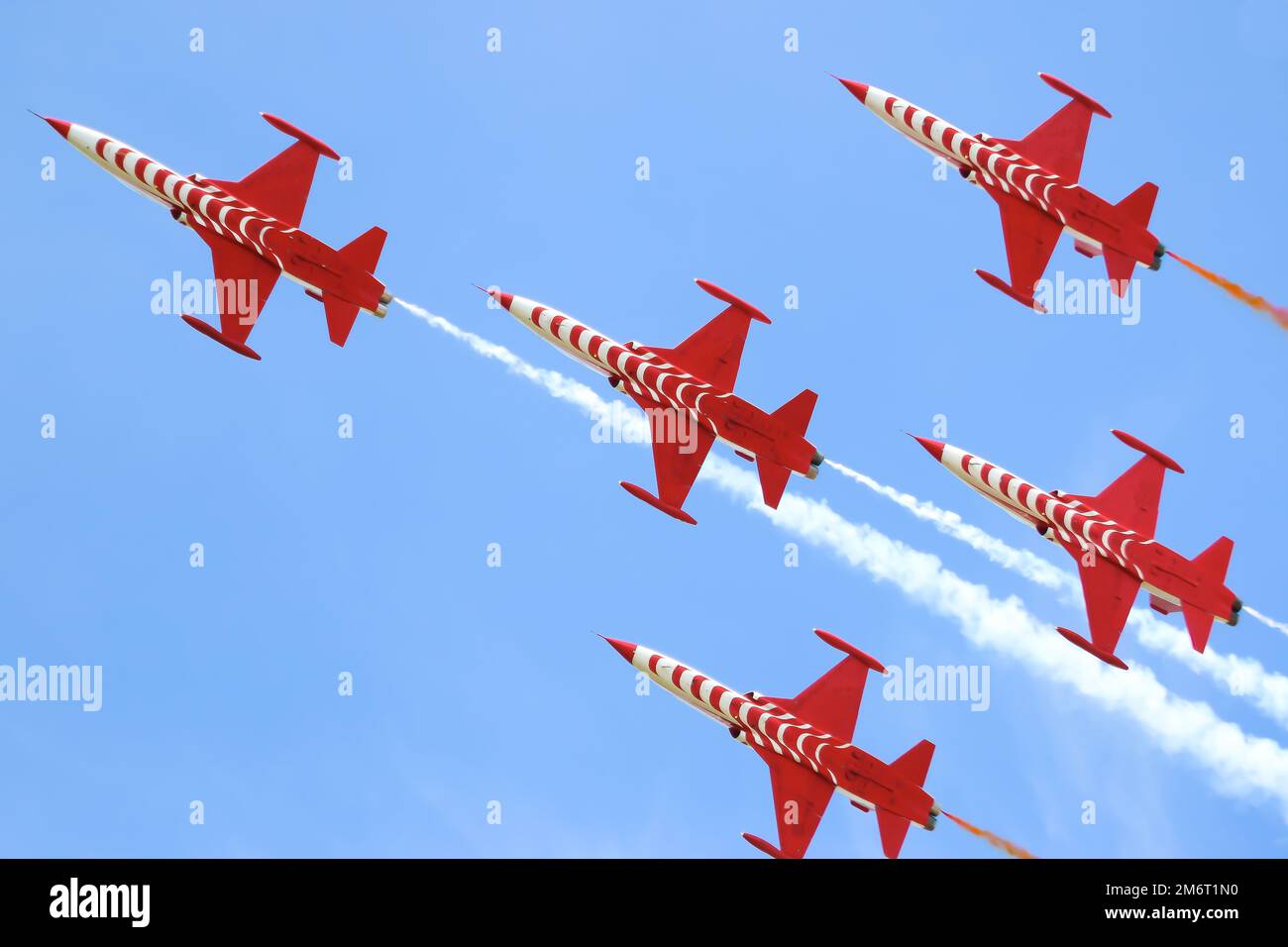 Airshow, Turkish Stars jet air force demonstration Team Acrobatics performing, flight in the sky. Copy Space, National days. Stock Photo