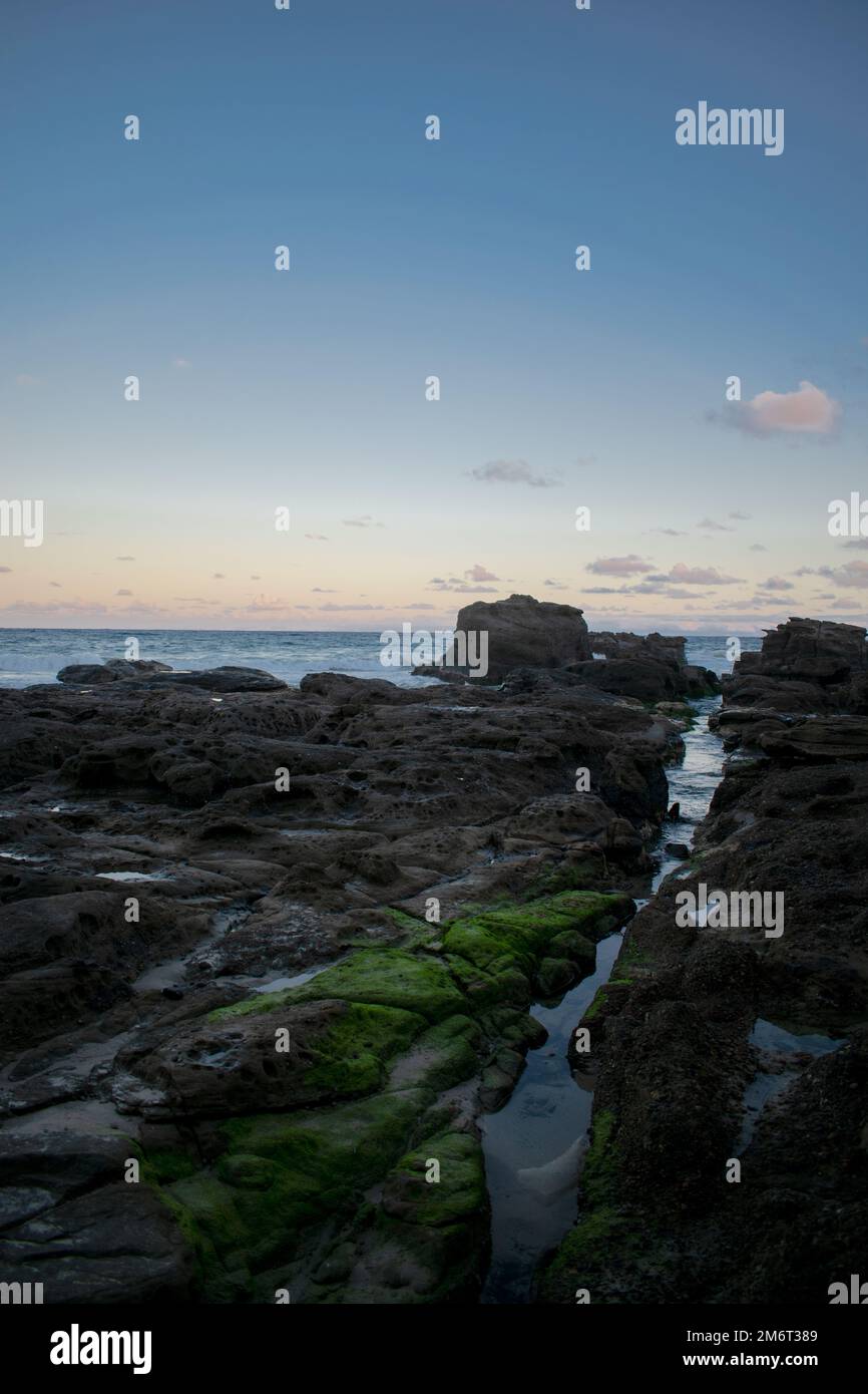 Sunset on a stony coast Australia Stock Photo