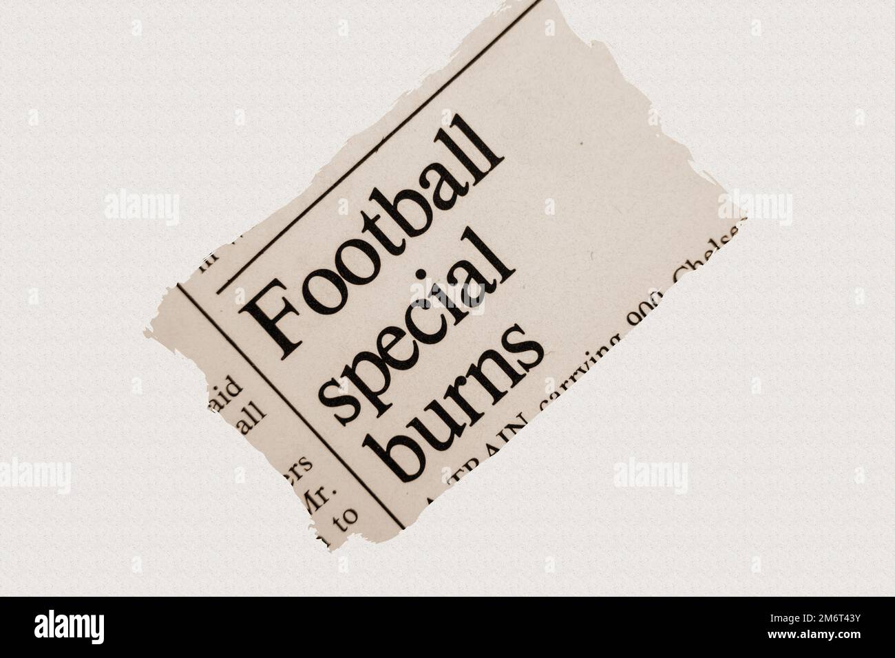 news story from 1975 newspaper headline article title - Football special burns in sepia Stock Photo