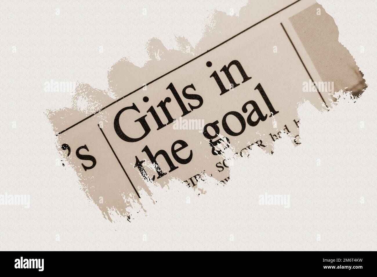 news story from 1975 newspaper headline article title - Girls in the goal in sepia Stock Photo