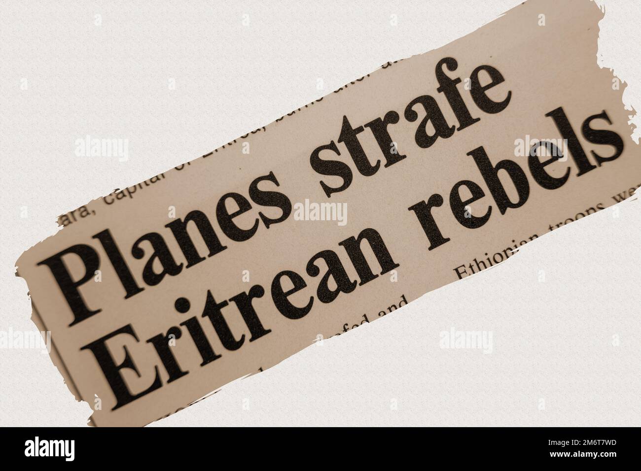 news story from 1975 newspaper headline article title - Planes strike Eritrean rebels - sepia Stock Photo