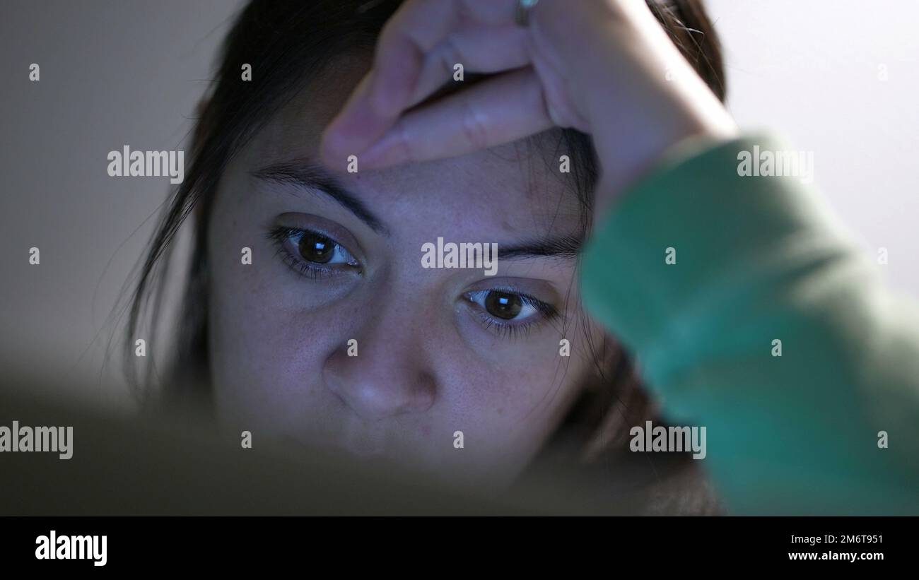 Close-up woman eyes staring at screen at night browsing internet Stock ...