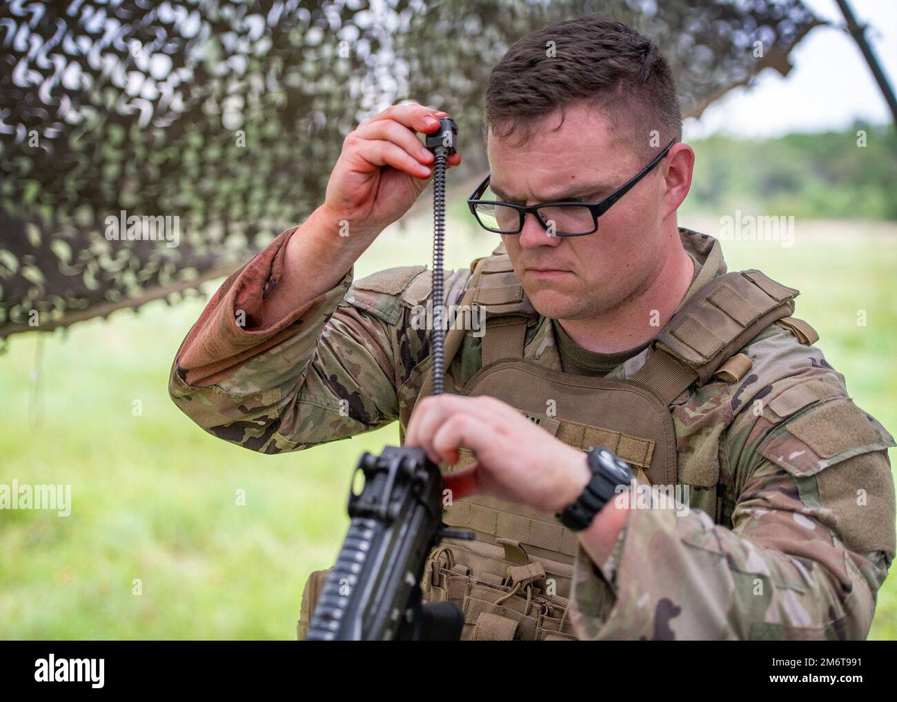 Sgt. Christopher McHann, Regional Training Institute, Texas Army National Guard, is timed as he breaks down and re-assembles a M249 Squad Automatic Weapon(SAW), during the Best Warrior Competition at Camp Swift, May 5, 2022. The three-day competition challenges service members on professional military knowledge, marksmanship, obstacle course and land navigation. The Army winners of this event will move on to represent Texas at the National Guard’s Region V Best Warrior Competition. Texas Army National Guard photo by Sgt. 1st Class Mark Scovell Stock Photo