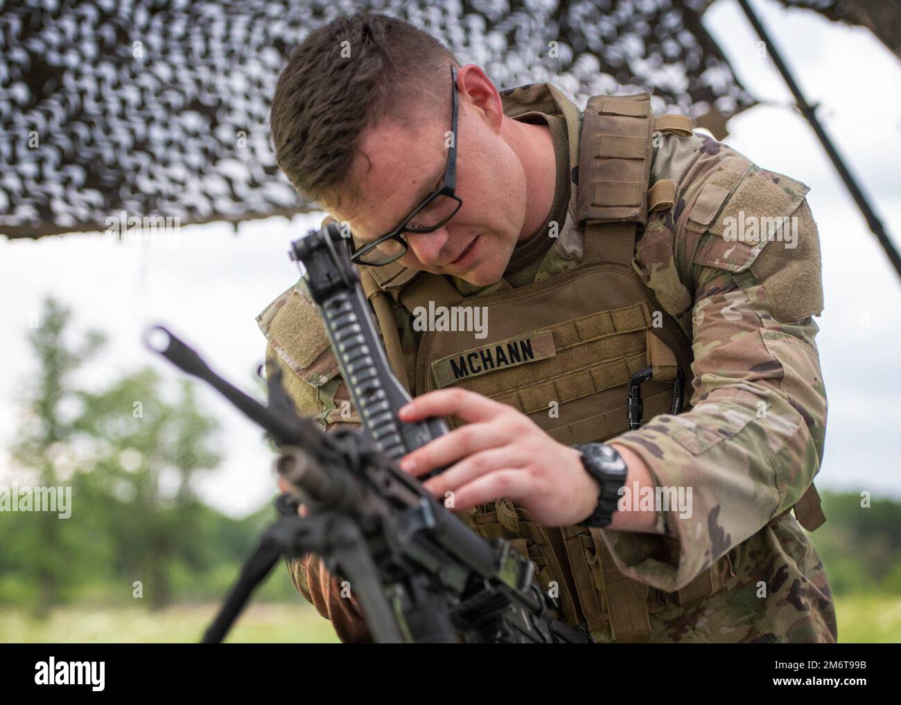 Sgt. Christopher McHann, Regional Training Institute, Texas Army National Guard, is timed as he breaks down and re-assembles a M249 Squad Automatic Weapon (SAW), during the Best Warrior Competition at Camp Swift, May 5, 2022. The three-day competition challenges service members on professional military knowledge, marksmanship, obstacle course and land navigation. The Army winners of this event will move on to represent Texas at the National Guard’s Region V Best Warrior Competition. Texas Army National Guard photo by Sgt. 1st Class Mark Scovell Stock Photo