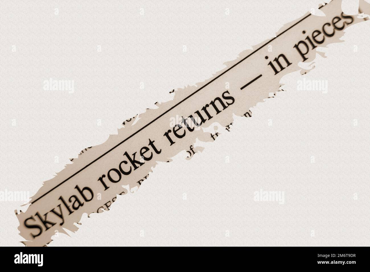 news story from 1975 newspaper headline article title - Skylab rocket returns - in pieces in sepia Stock Photo