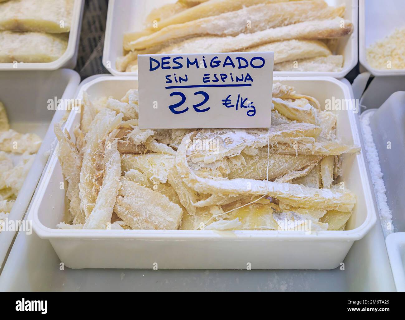 Dried pieces of salted cod or bacalao, traditional Spanish delicacy for sale at a local market in the old town or Casco Viejo in Pamplona, Spain Stock Photo