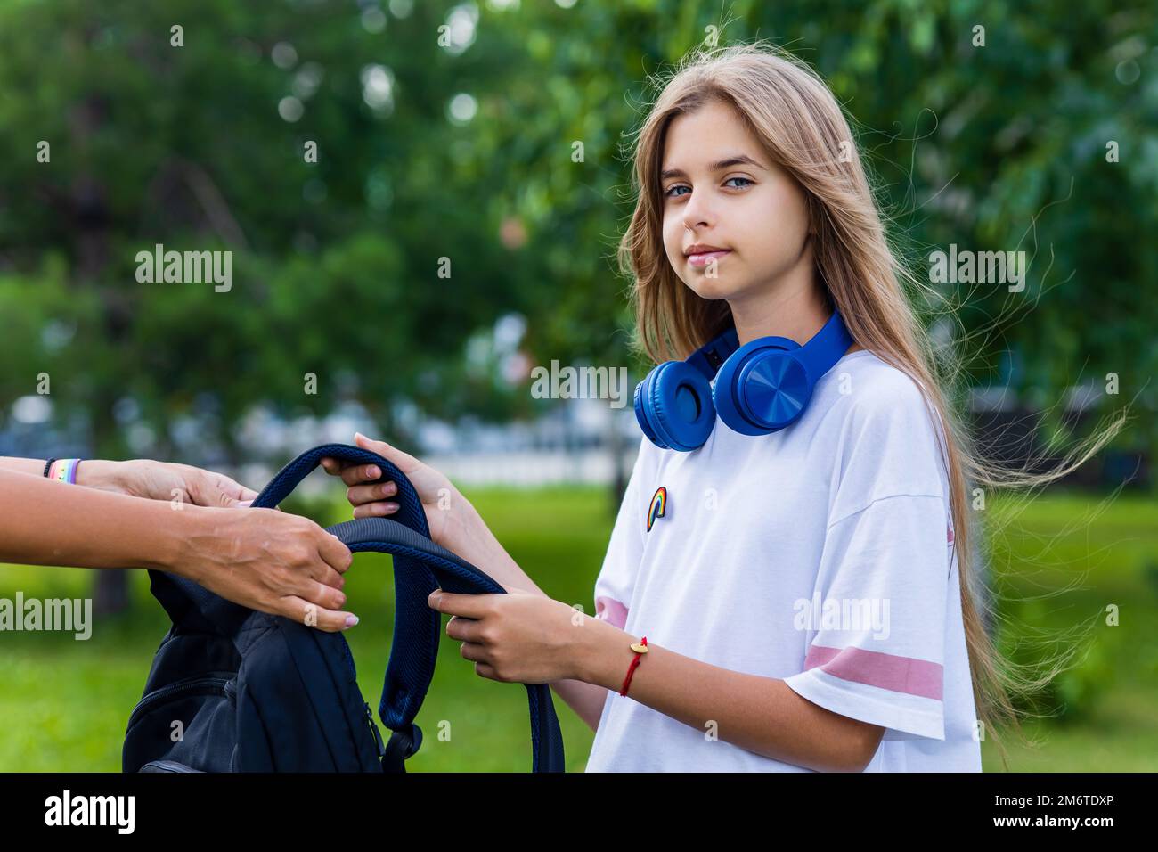 mother and daughter preparing backpack for school Stock Photo - Alamy