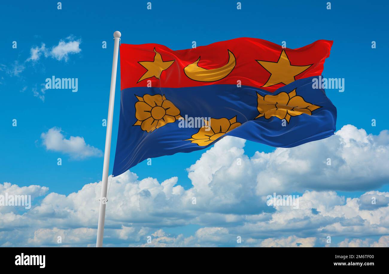 official flag of Drapeau ville ca Longueuil Quebec Canada at cloudy sky