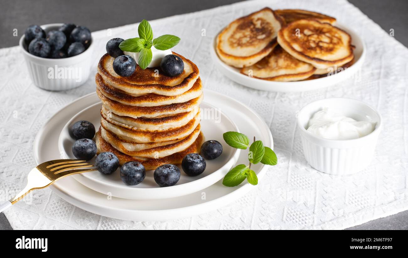 Breakfast pancakes with blueberries and sour cream Stock Photo
