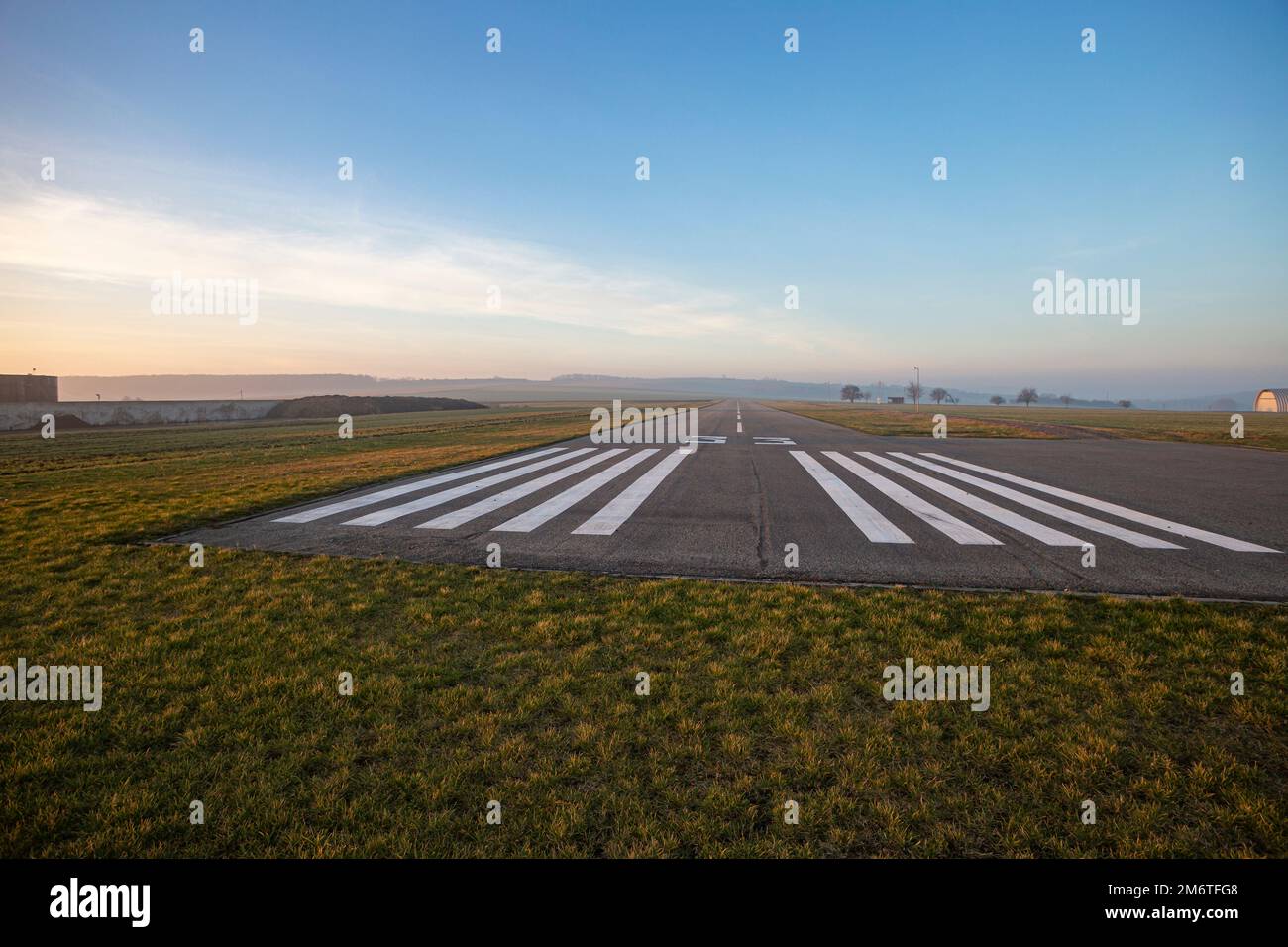 Small empty field airport with asphalt runway Stock Photo