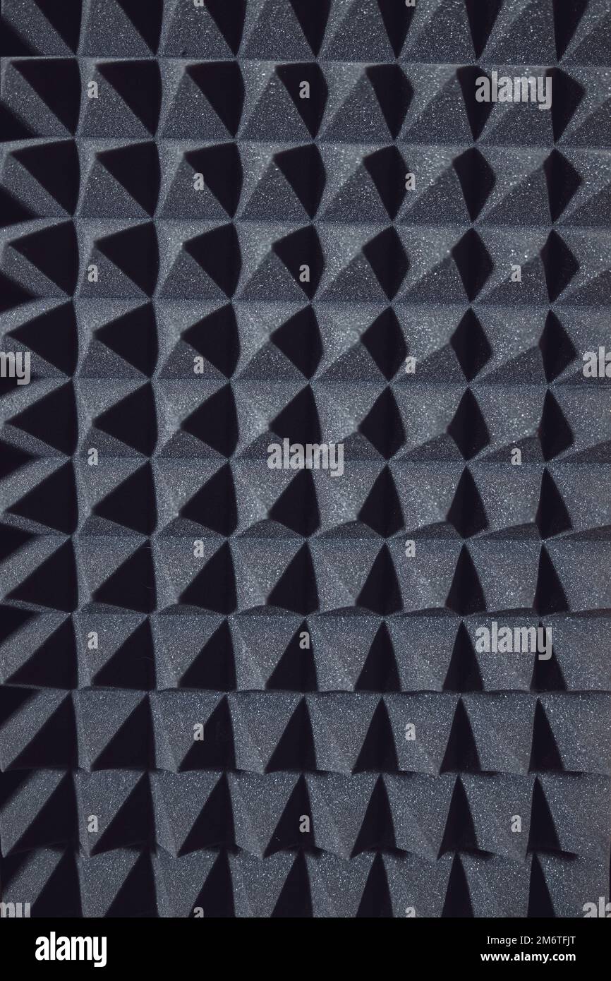 Black soundproof wall with acoustic dampening foam. Soundproof room in professional sound recording studio Stock Photo