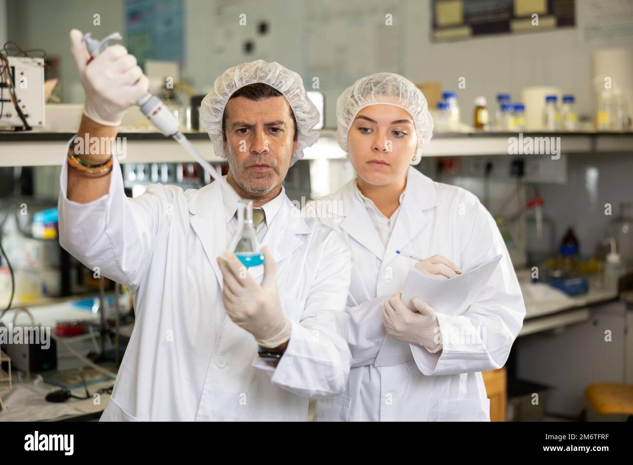Confident man technician working in research laboratory Stock Photo - Alamy