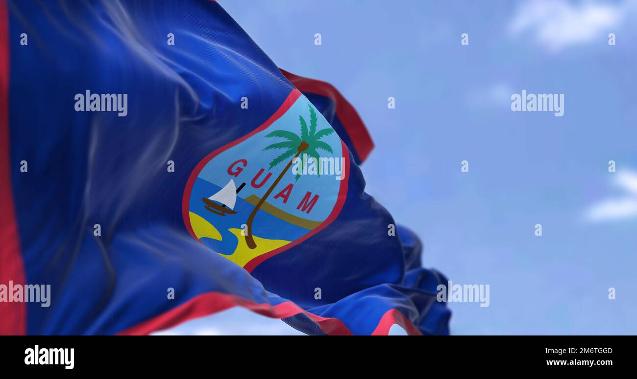 Flag of Guam waving in the wind on a clear day Stock Photo